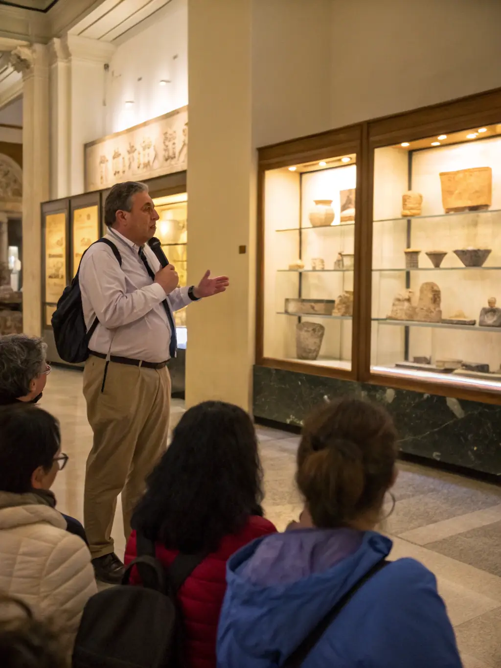 An archaeologist examining ancient documents and artifacts in a well-lit archive room, showcasing the meticulous work involved in historical research and documentation.